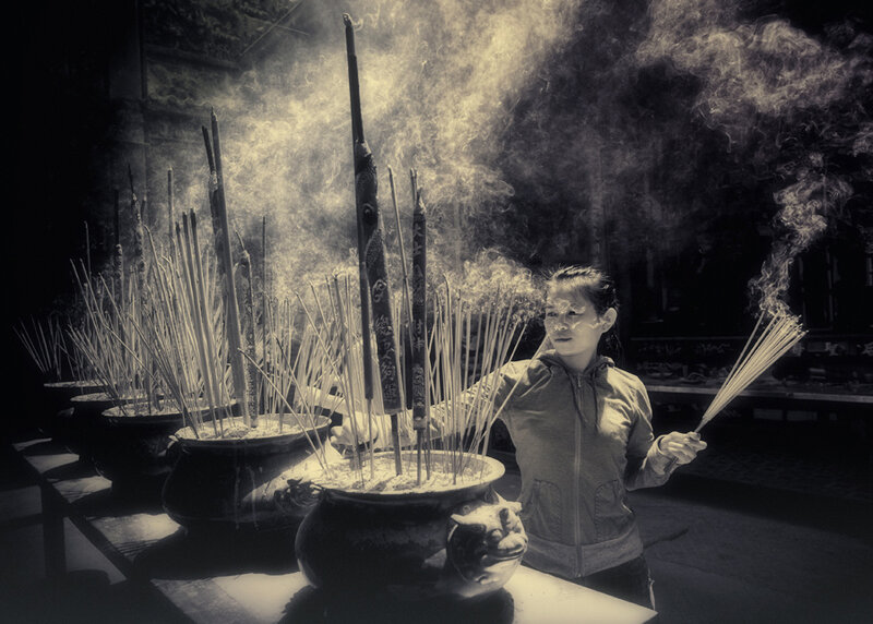 Woman Holding Incense Sticks
