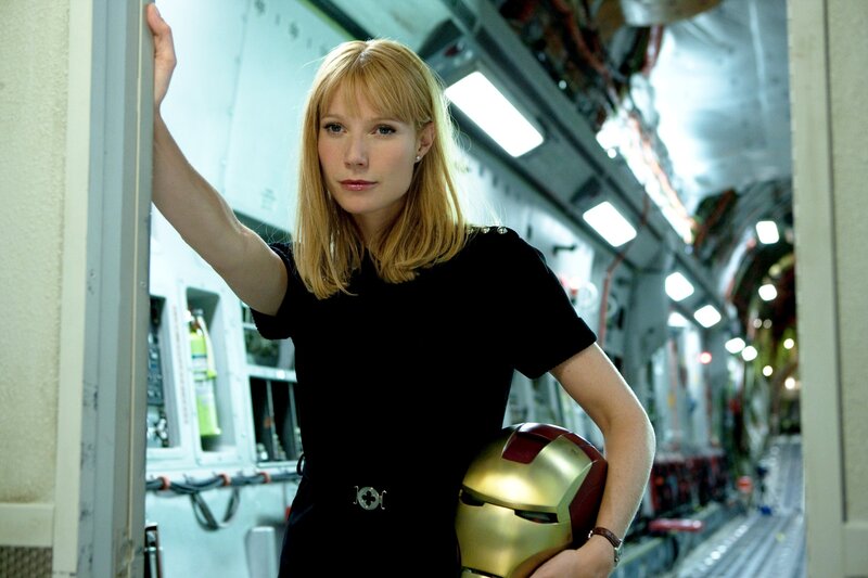 Woman holding Iron Man helmet
