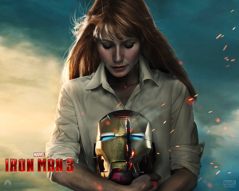 Woman holding Iron Man helmet