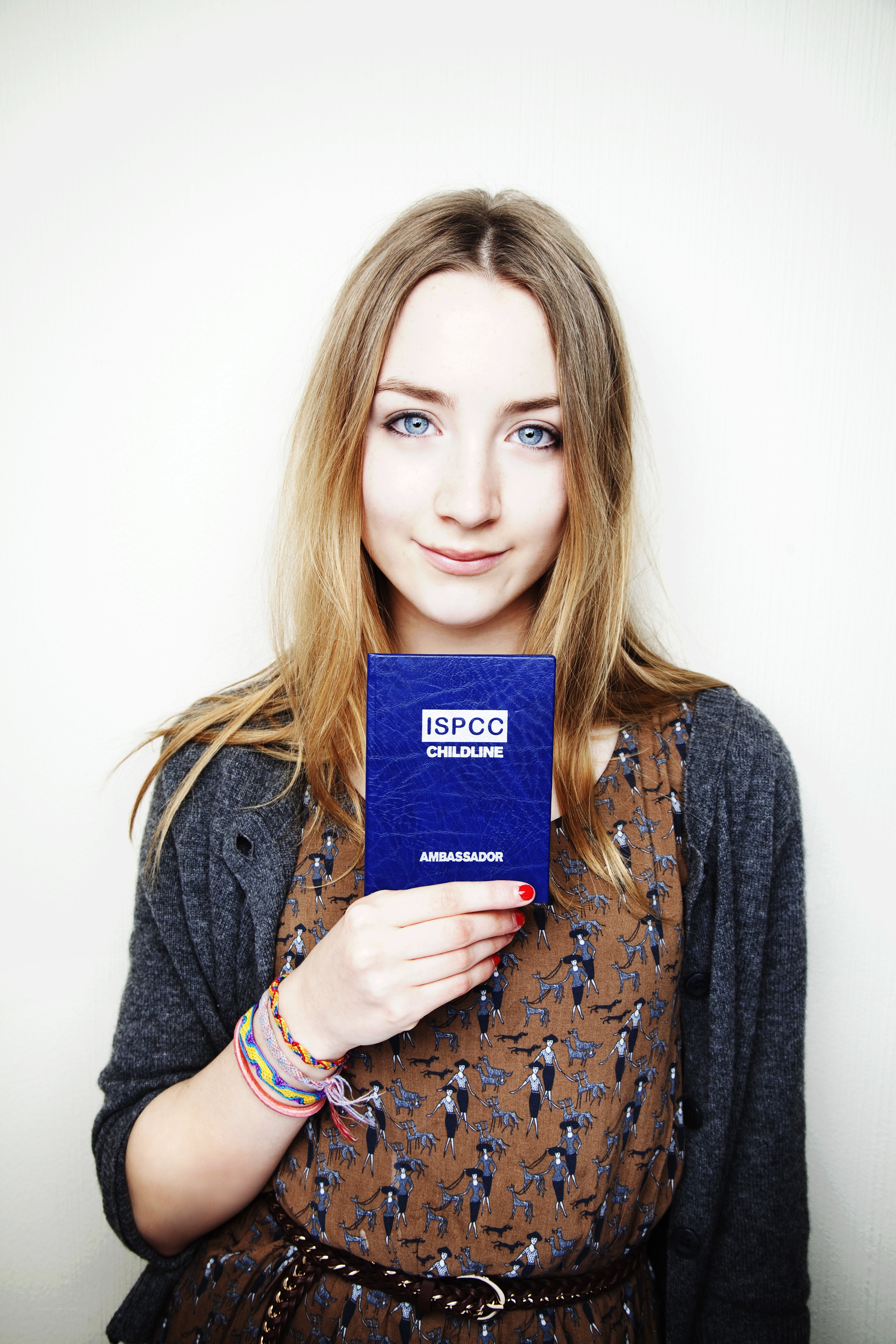 Woman holding ISPCC card