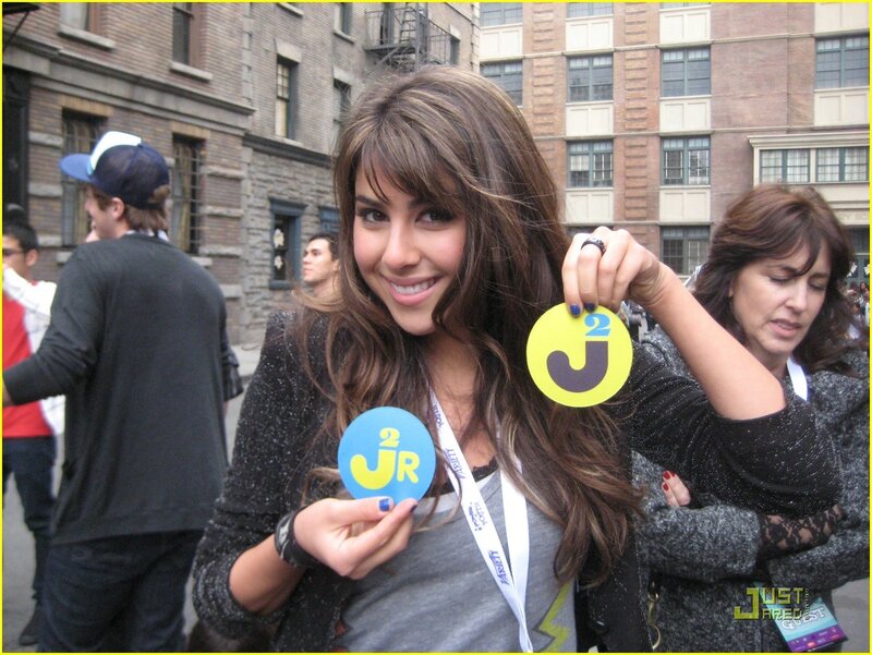 Woman Holding J2R Badges