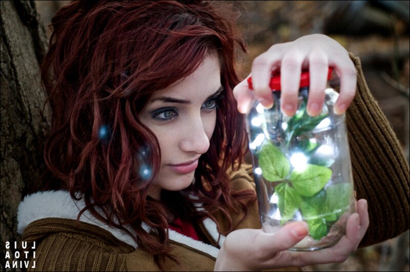 woman holding jar with lights