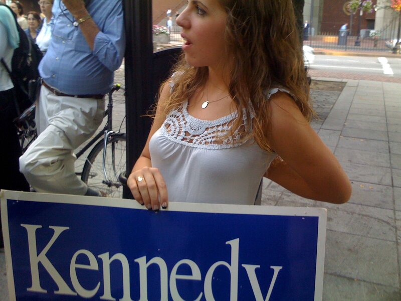woman holding kennedy sign