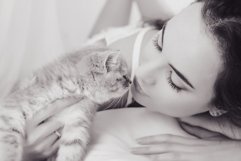 Woman Holding Kitten — Black, Serene