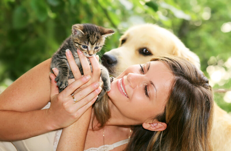 Woman Holding Kitten — Green, Peaceful