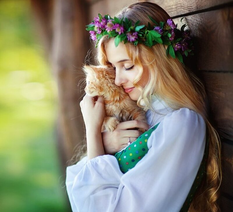 Woman Holding Kitten — Green, Serene