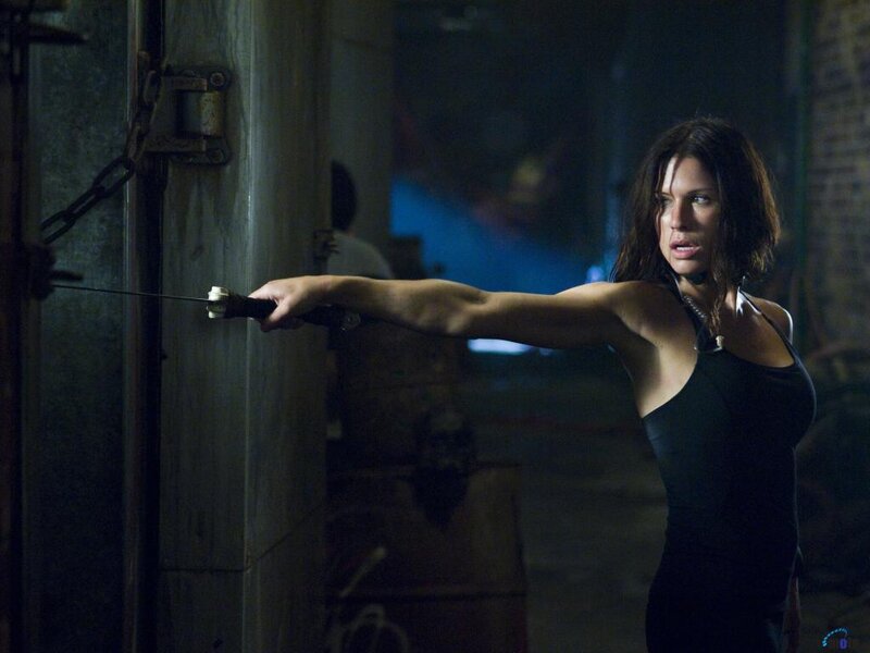 Woman Holding Knife — Black, Tense