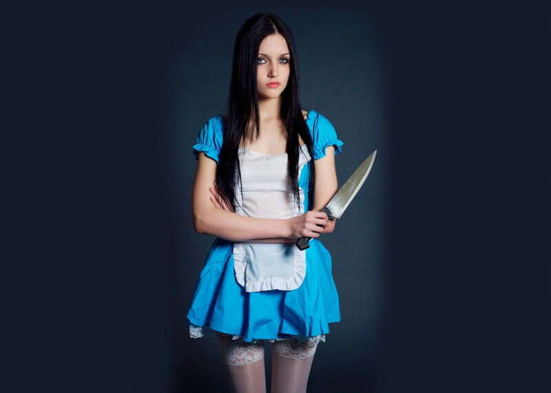 Woman Holding Knife — Blue, Dramatic