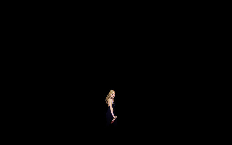 woman holding knife in dark