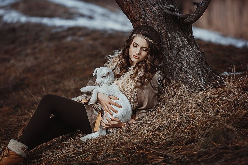 Woman Holding Lamb — Brown, Serene