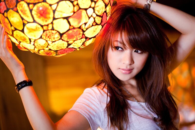 Woman Holding Lamp — Yellow