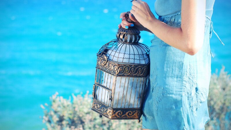 Woman Holding Lantern — Blue, Serene, Afternoon