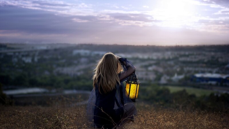 Woman Holding Lantern — Purple, Contemplative, Sunset