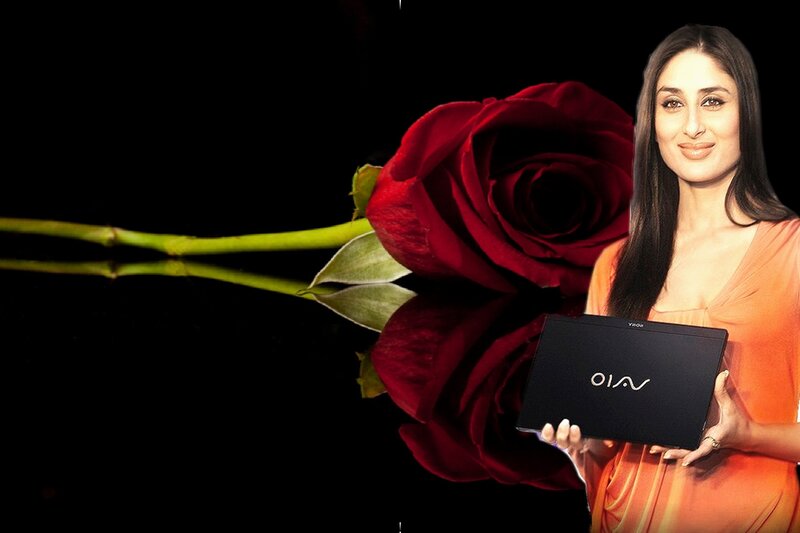 woman holding laptop with rose