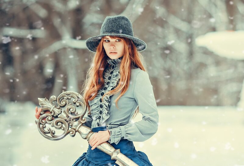 Woman Holding Large Key