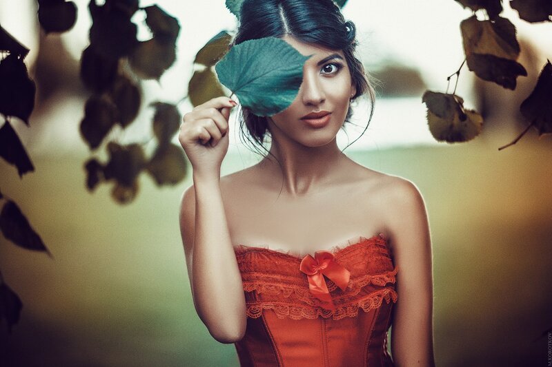Woman Holding Leaf — Red
