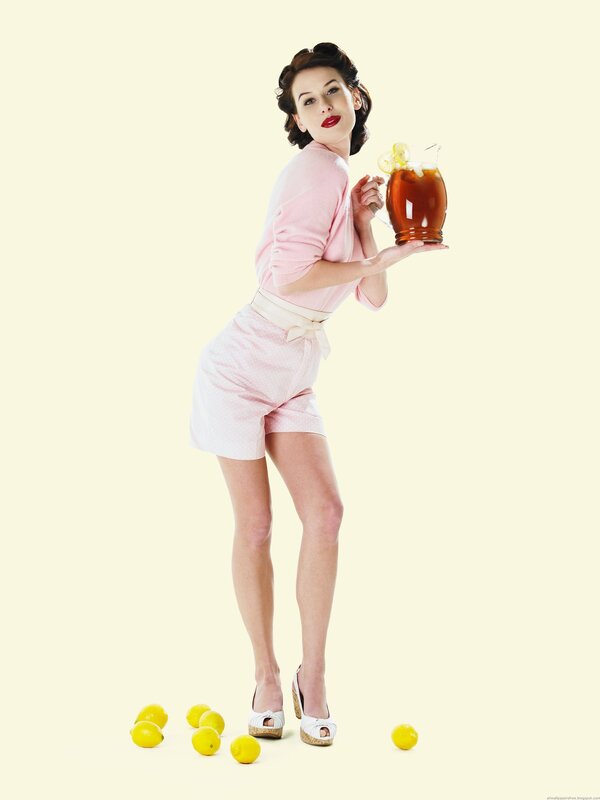 woman holding lemonade pitcher