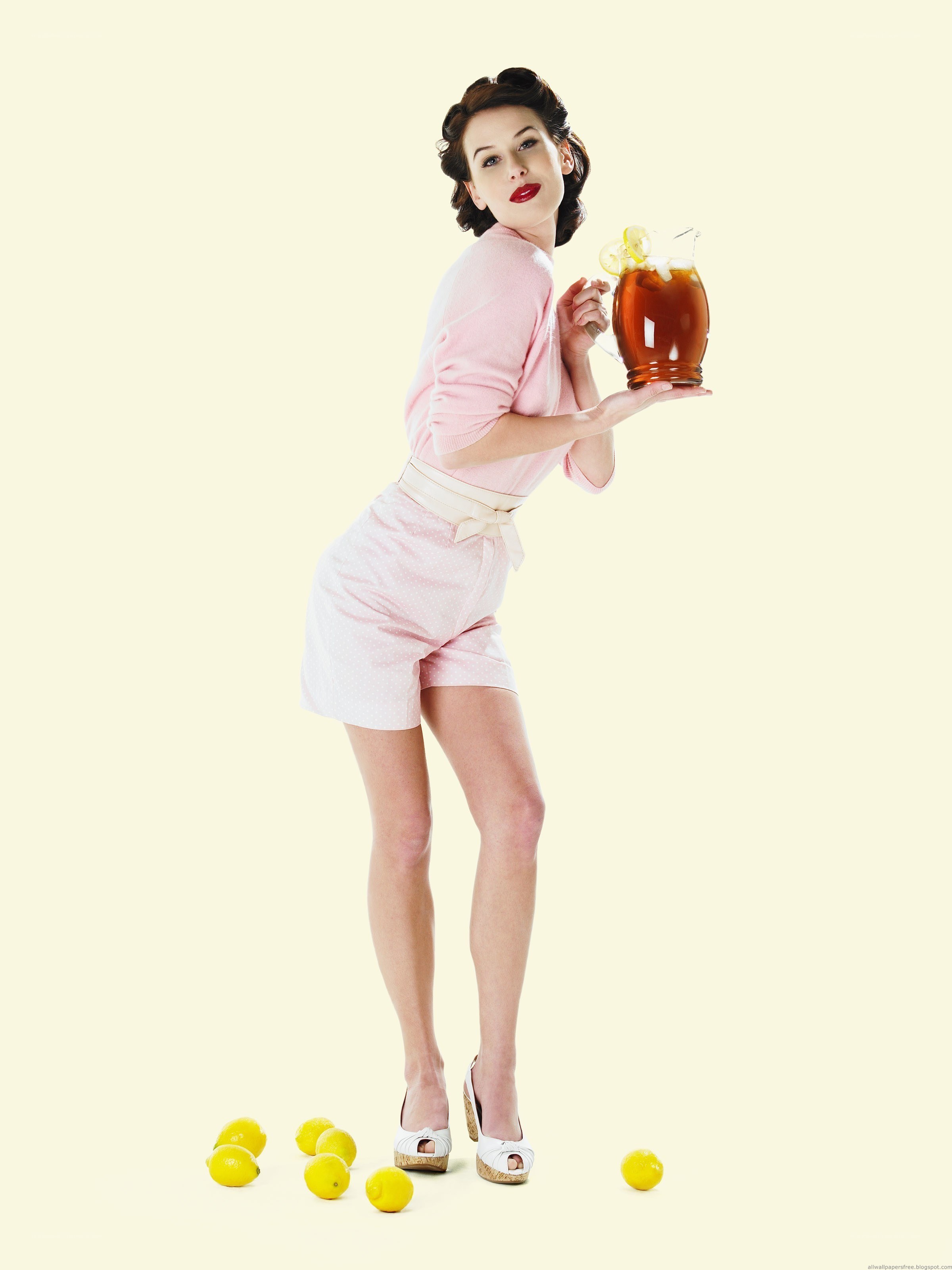woman holding lemonade pitcher
