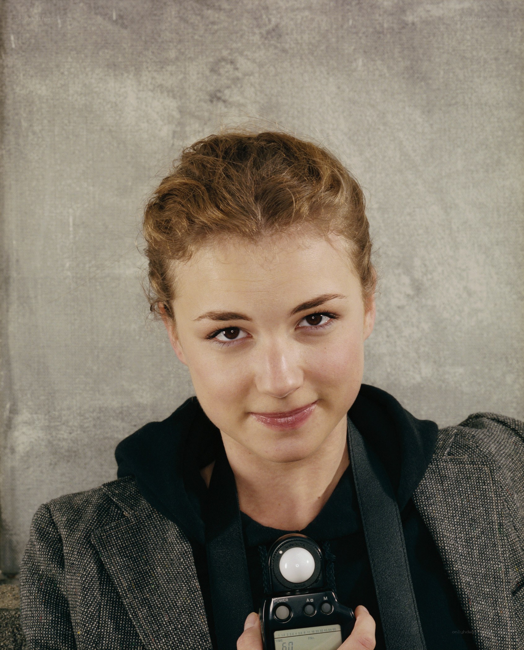 Woman holding light meter