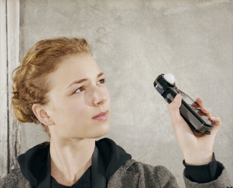 woman holding light meter