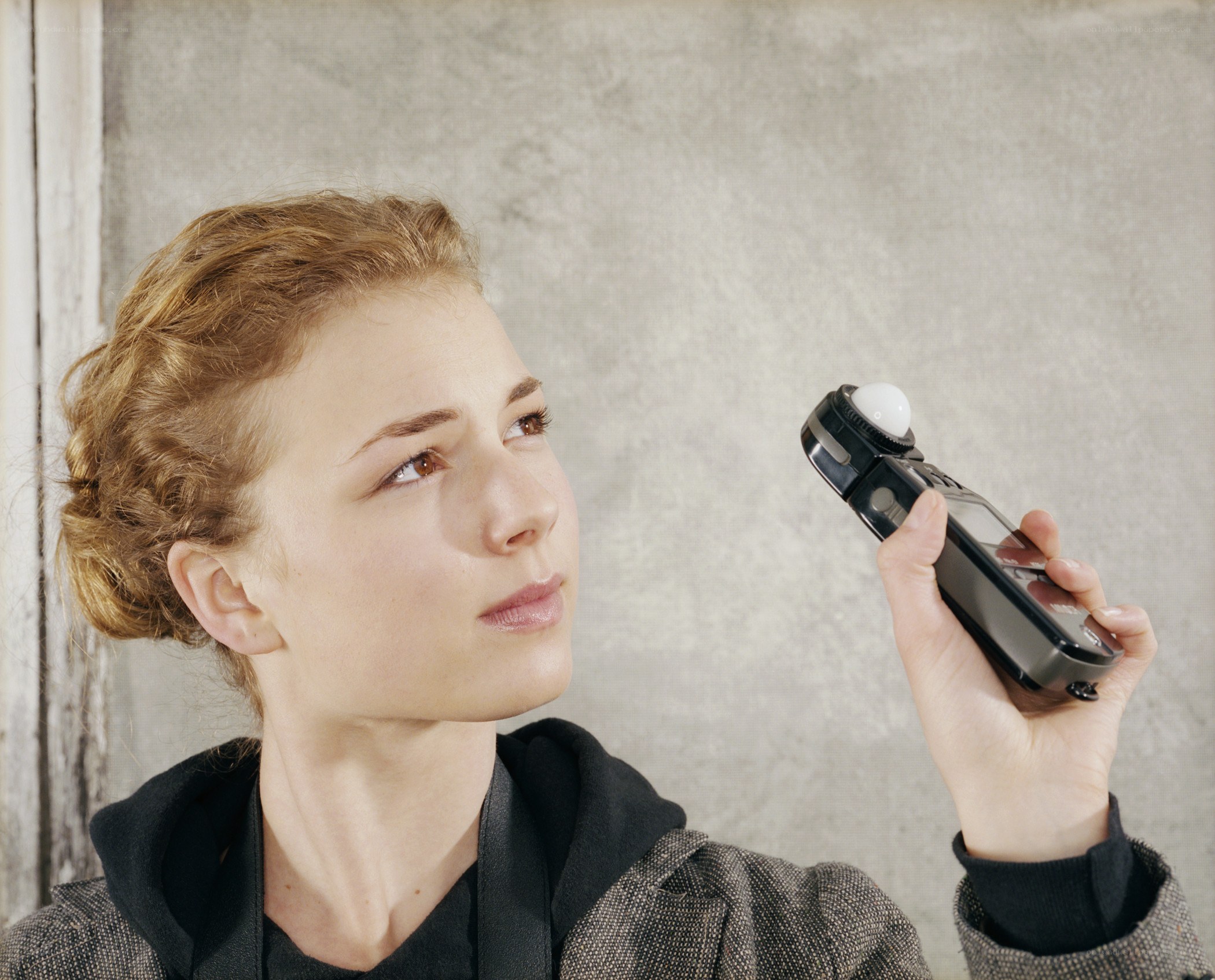 woman holding light meter