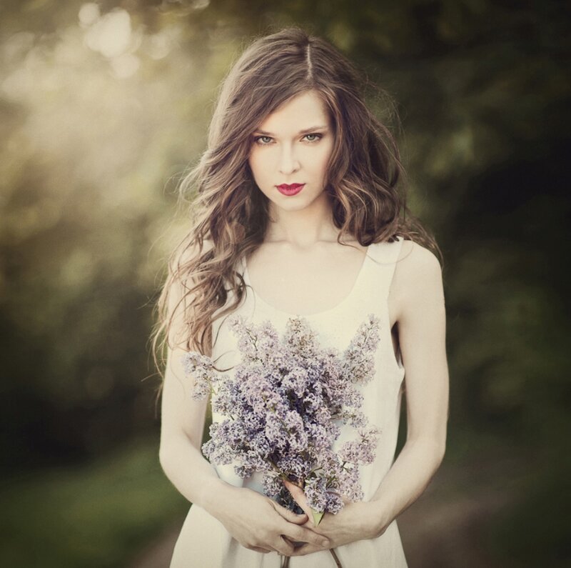 Woman Holding Lilacs