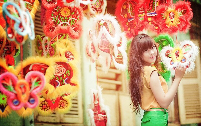 Woman Holding Lion Dance Head