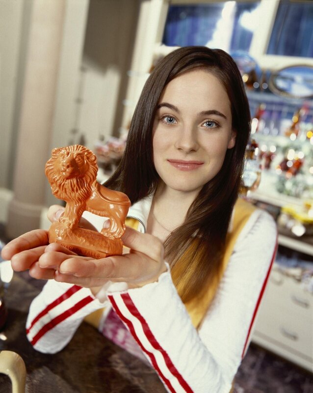 woman holding lion figurine