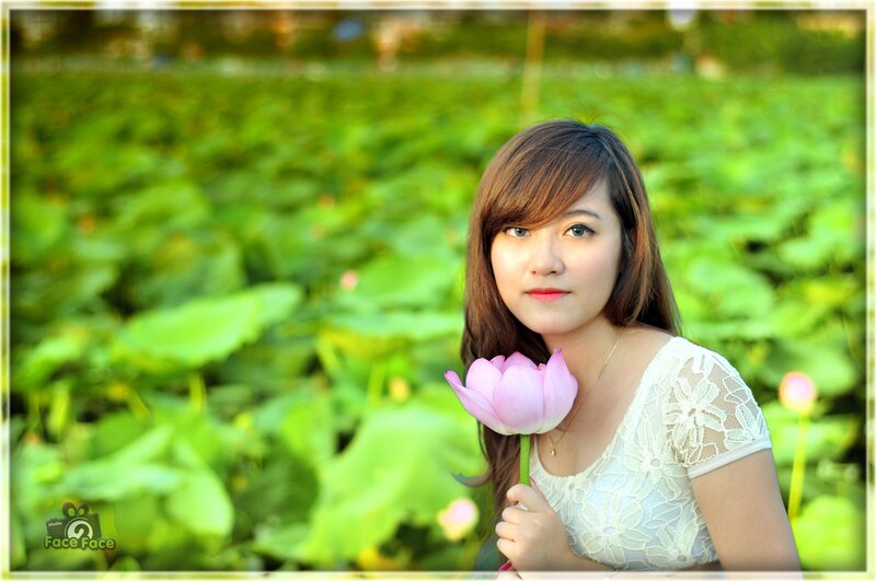 woman holding lotus flower