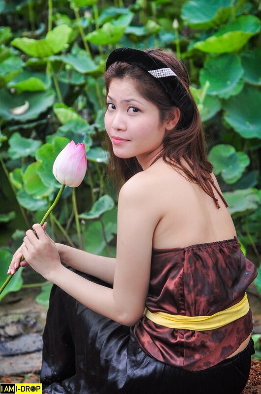 woman holding lotus flower