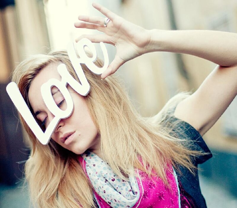 Woman Holding Love Sign