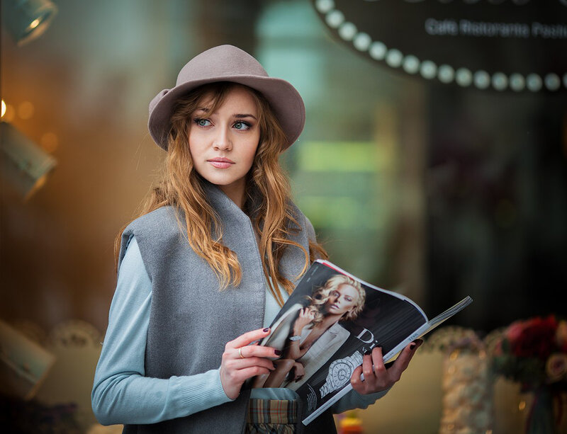 Woman Holding Magazine — Gray