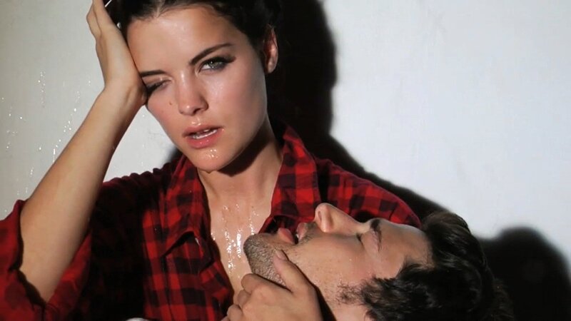 woman holding man's head