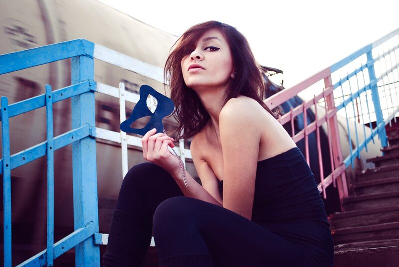 woman holding mask on stairs