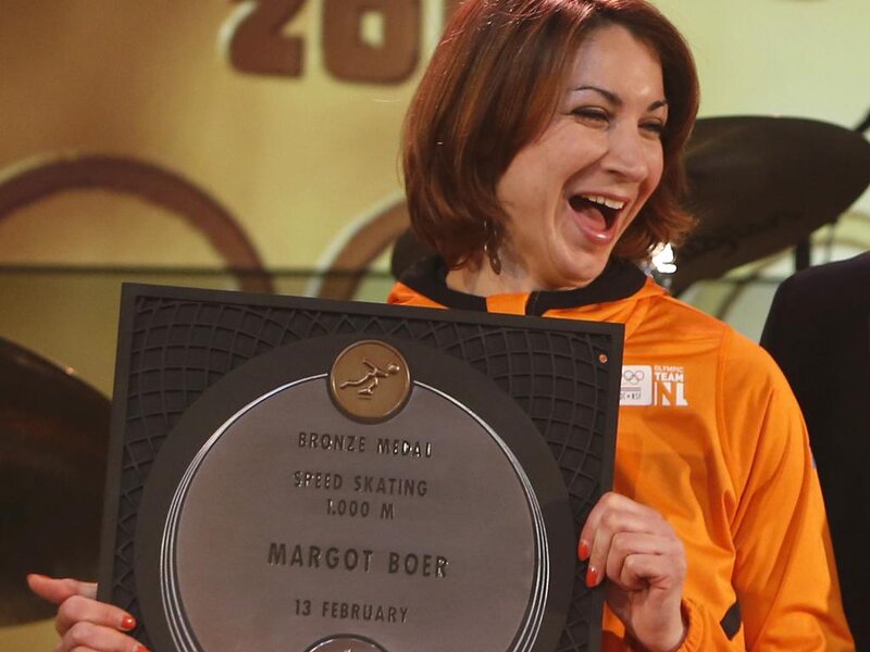 Woman Holding Medal — Orange