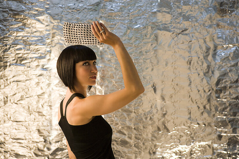Woman Holding Metal Object