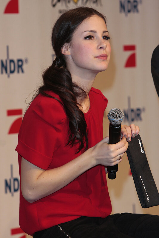 woman holding microphone at event