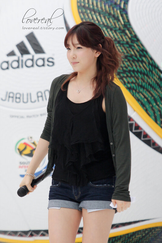 woman holding microphone at event