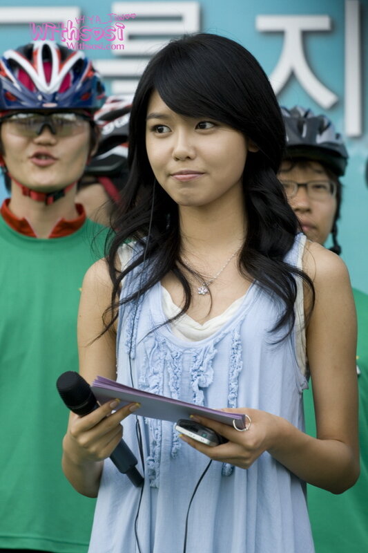 woman holding microphone at event