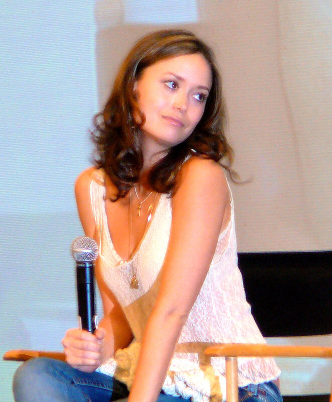 woman holding microphone at event