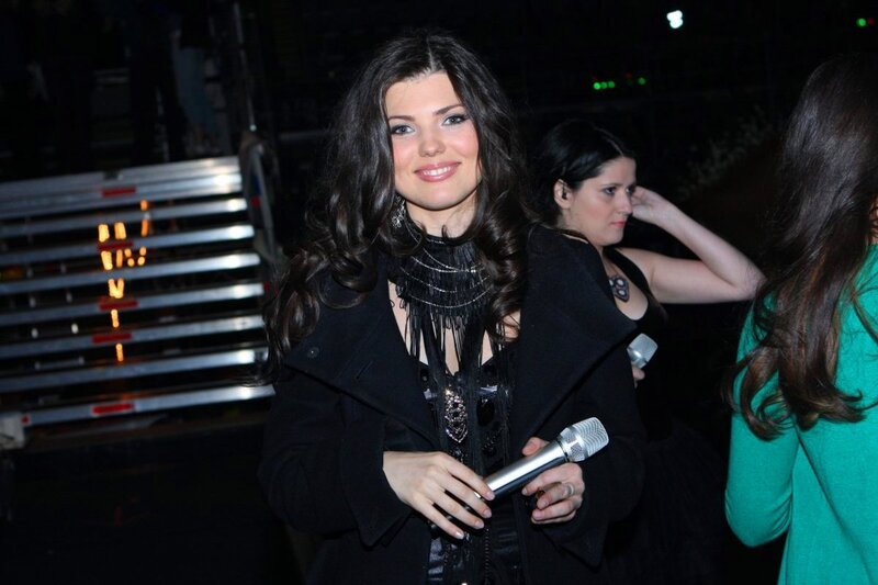 Woman Holding Microphone — Black, Casual