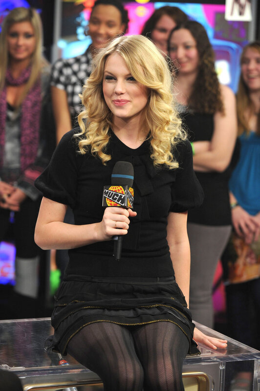woman holding microphone on set