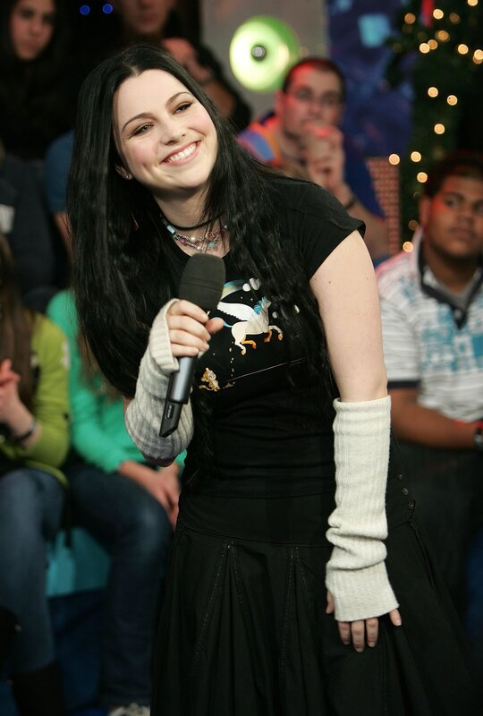 woman holding microphone on stage