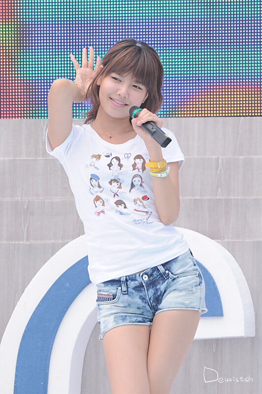 woman holding microphone on stage