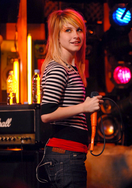 woman holding microphone on stage
