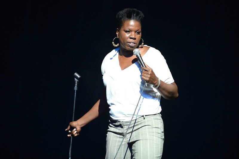 Woman Holding Microphone — White, Focused