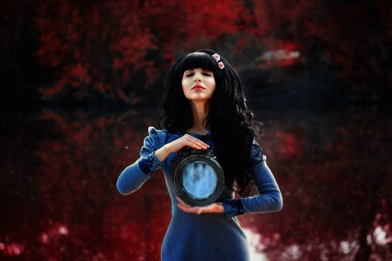 Woman Holding Mirror — Blue