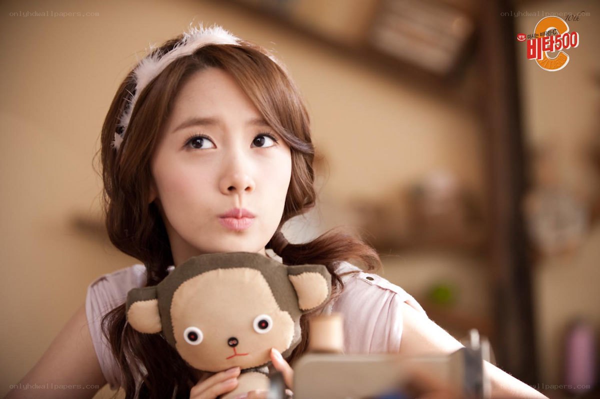 woman holding monkey plush