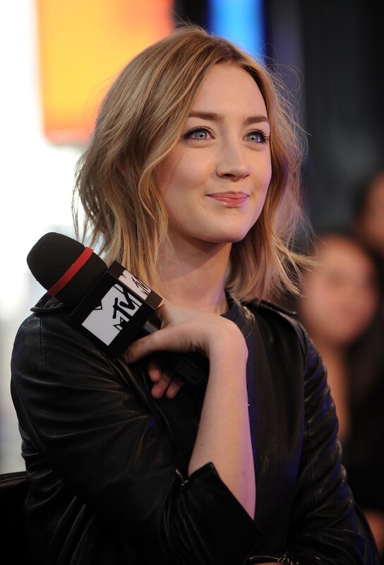 woman holding mtv microphone
