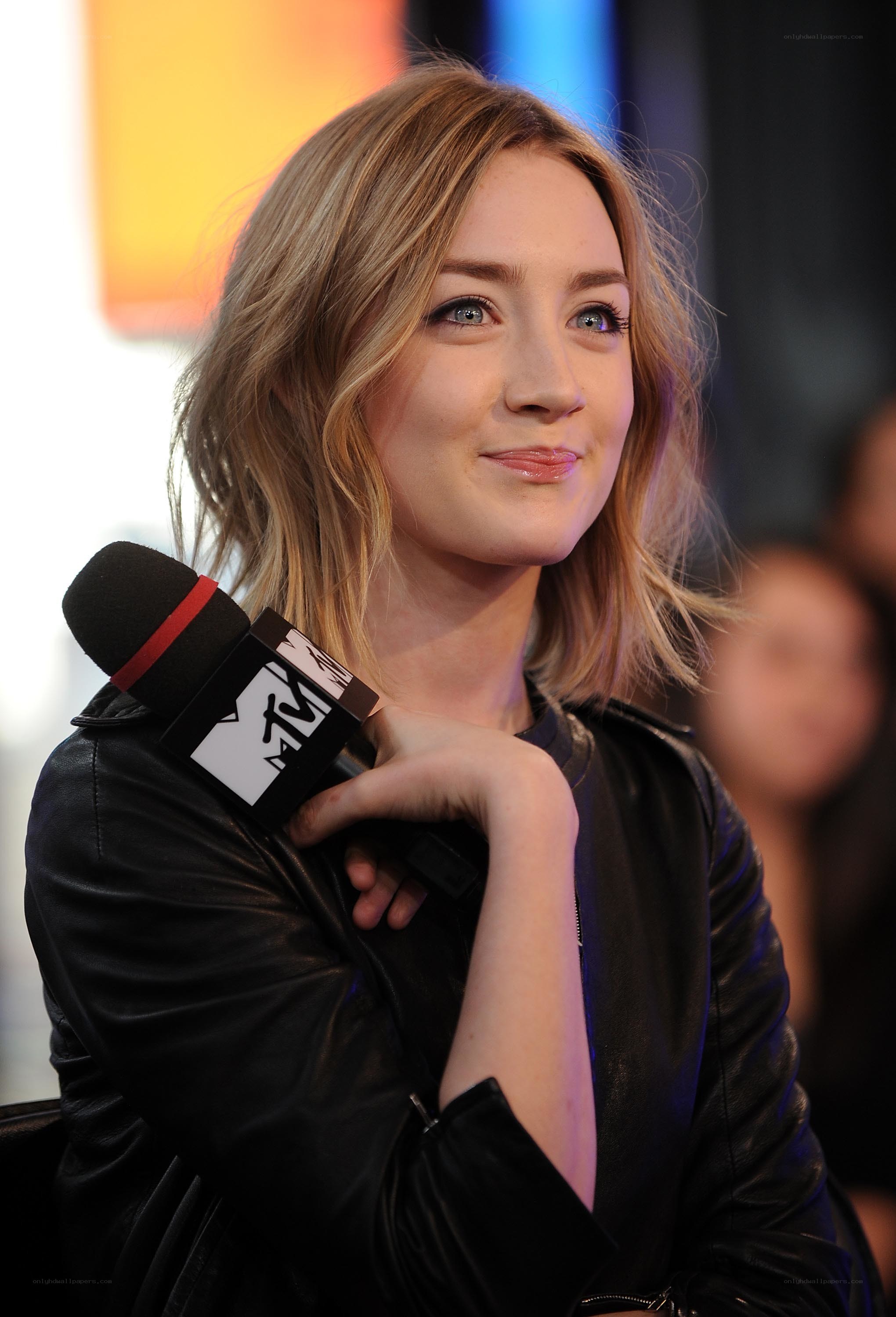 woman holding mtv microphone